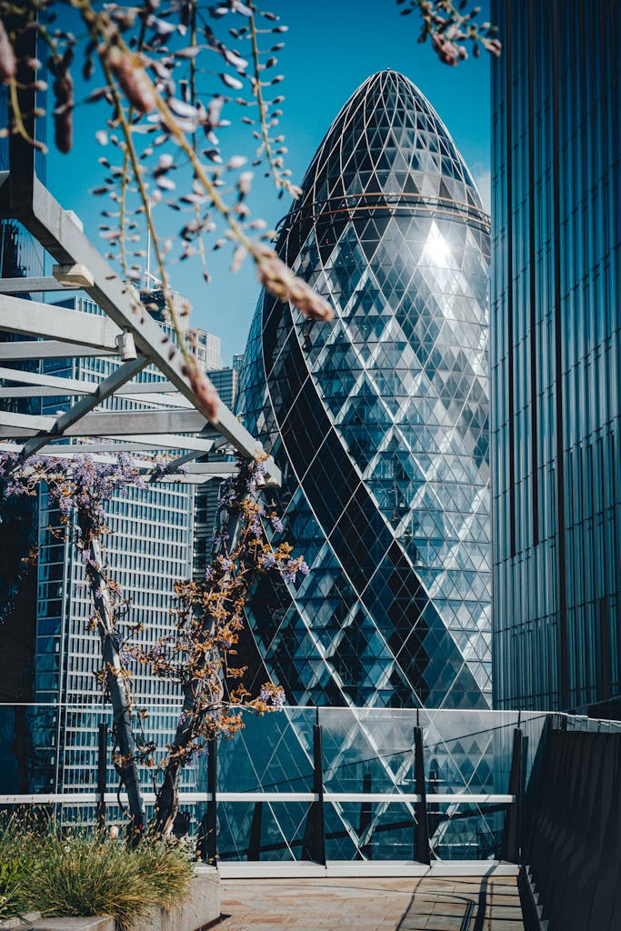 A captivating view of The Gherkin in London set against a vibrant springtime floral backdrop.