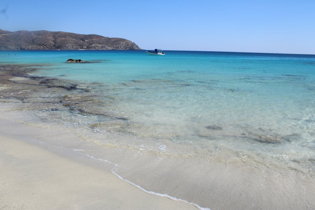 Discover the serene beauty of Crete's turquoise waters and sandy beaches in Greece.