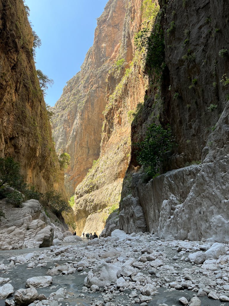 Hikers exploring the stunning Samaria Gorge in Crete, Greece.