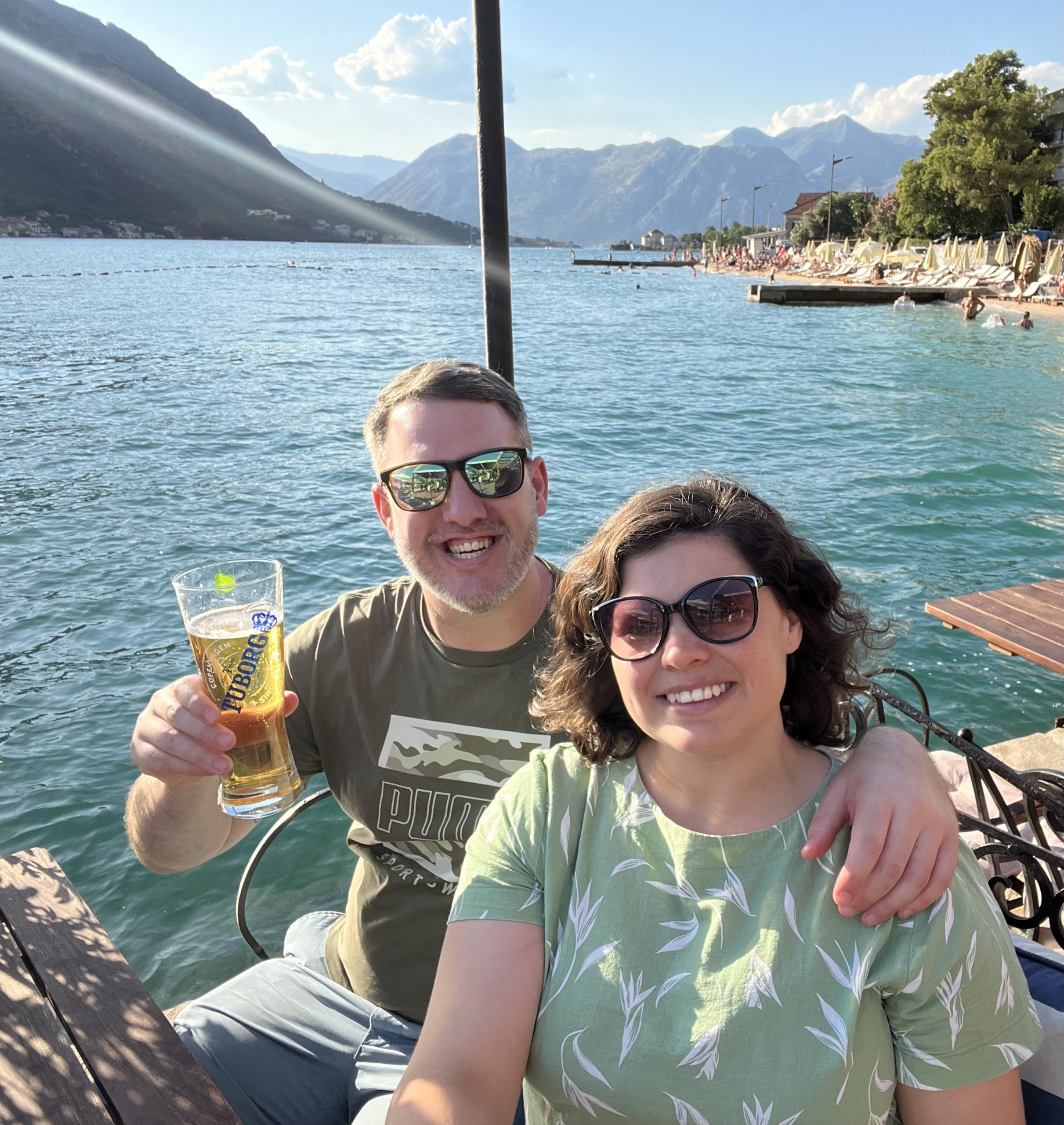 Couple enjoying an evening meal overlooking the Bay of Kotor in Montenegro.