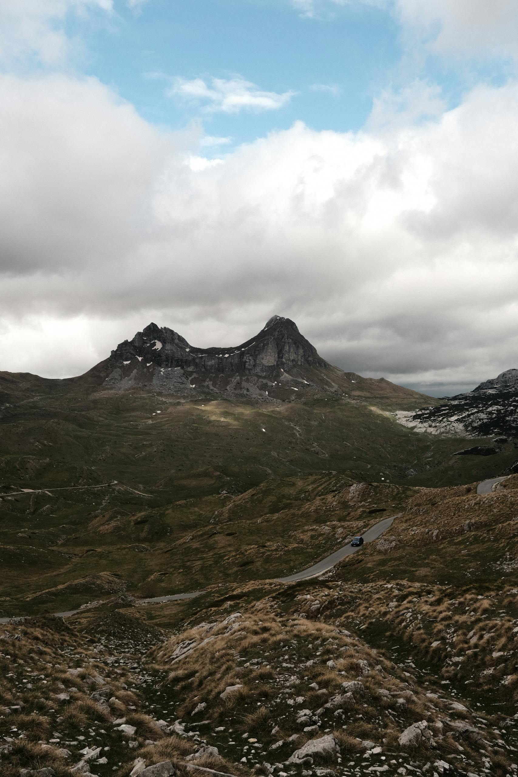 Majestic Durmitor mountain peaks with cloudy skies in Montenegro's national park.