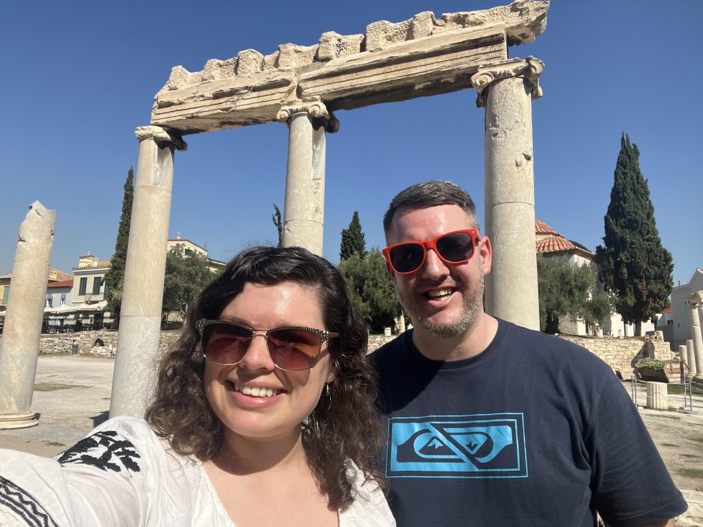 A couple enjoying the ancient sites of Athens at the Roman Agora.