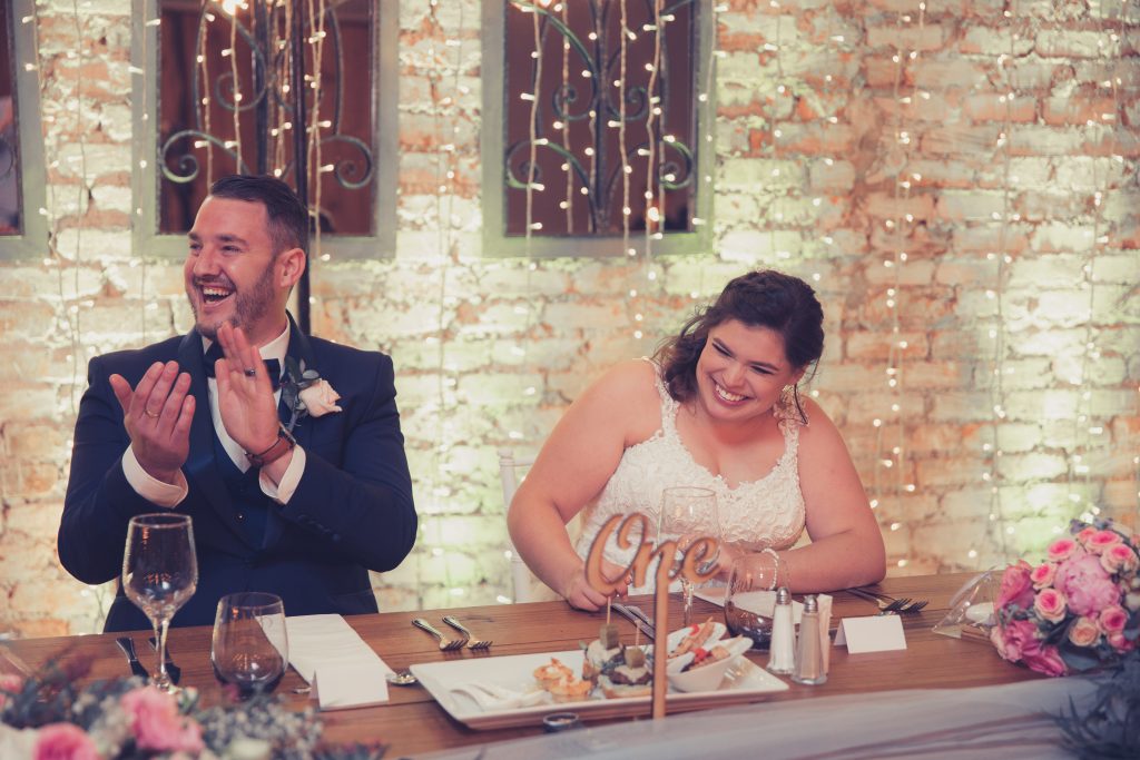 Happy couple on their wedding day, full of joy, love and having fun.