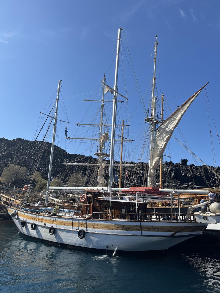 Sailing boat on the Aegean Sea near Santorini, Greece.