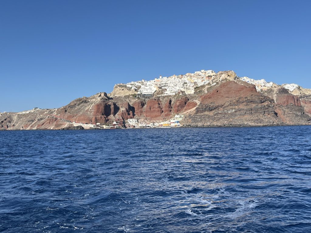 Fira, Santorini Island from the boat on the Aegean Sea.